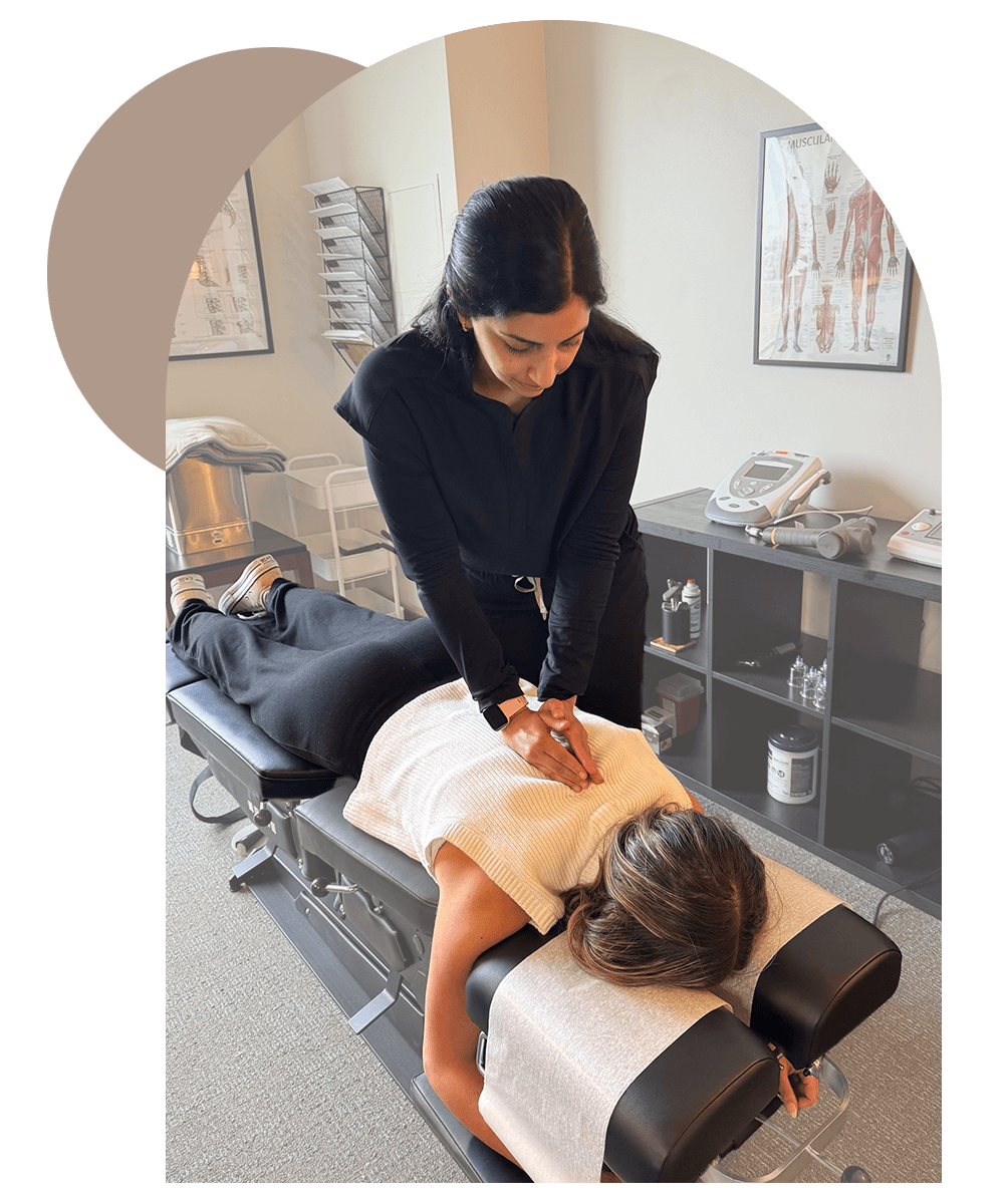 Patient receiving chiropractic adjustment from chiropractor in Overland Park